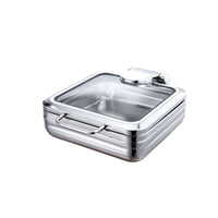 A stainless steel chafing dish with a glass lid on a white background.