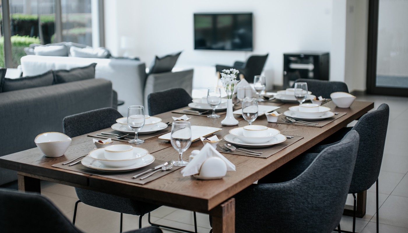 Dinner party table setting with dinnerware and servingware