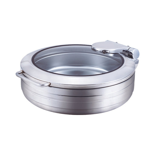 Close-up of a round induction chafing dish made of stainless steel with a clear glass lid, resting on a plain white surface.
