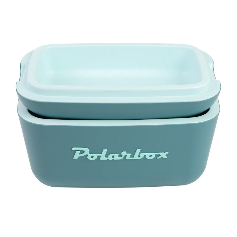 an Image of  A Polarbox 12L Classic Cooler Box in the color blue and marine. It features a leather strap for easy carrying. This cooler box is perfect for keeping beverages and food items cool during outdoor activities or picnics.