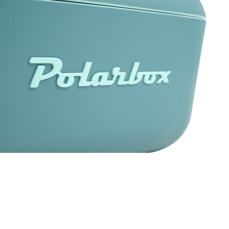 an Image of  A Polarbox 12L Classic Cooler Box in the color blue and marine. It features a leather strap for easy carrying. This cooler box is perfect for keeping beverages and food items cool during outdoor activities or picnics.